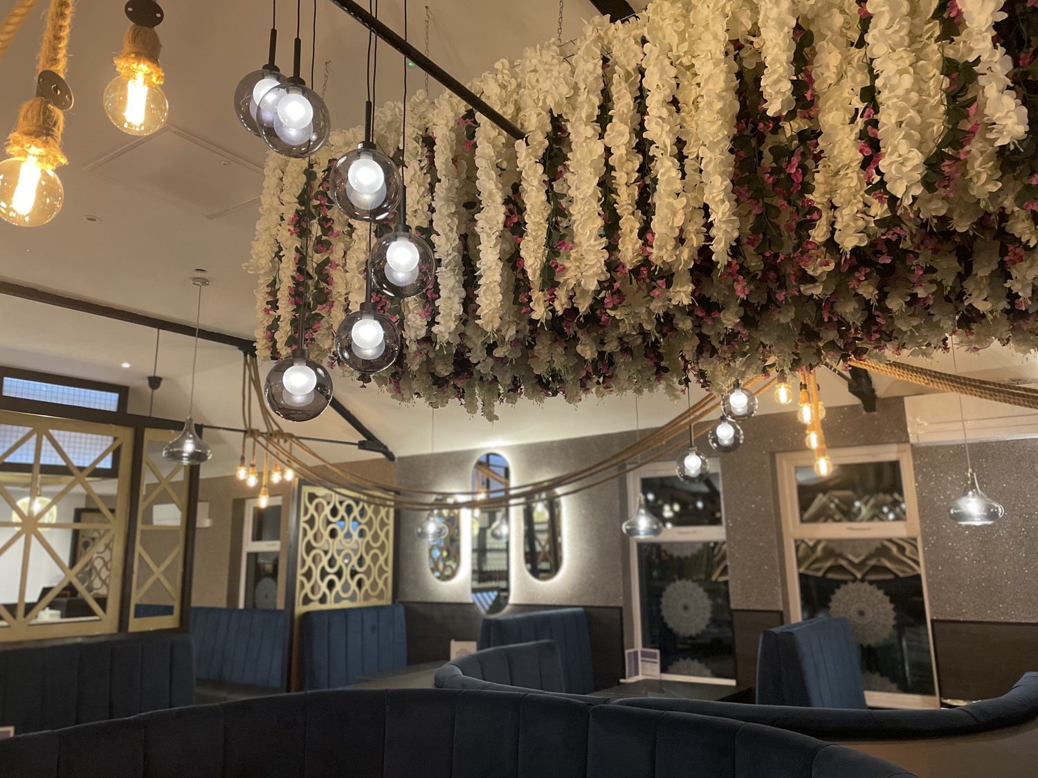 The warm, flower-filled interior at Stanwix Tandoori